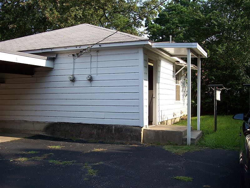 Convenient Laundry Room with 2 Washers and 2 Dryers + Storag