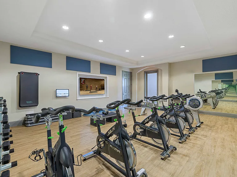 Fitness studio with on-demand virtual trainer and spin bikes
