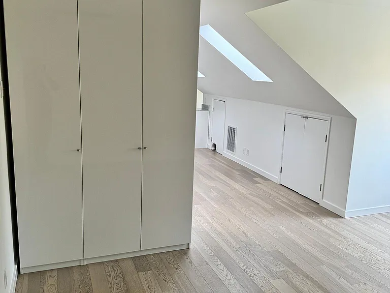 Bedroom with storage cabinets