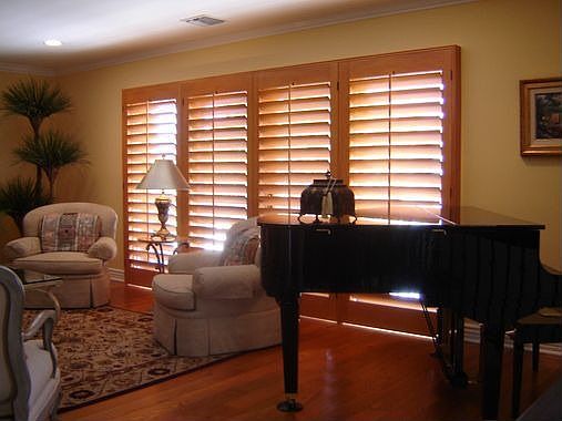 Custom maple plantation shutters throughout