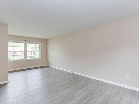 Spacious & bright living area-  brand new LVP & fresh paint throughout.