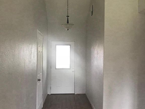 High Ceiling entrance way with new light fixtures  and new p