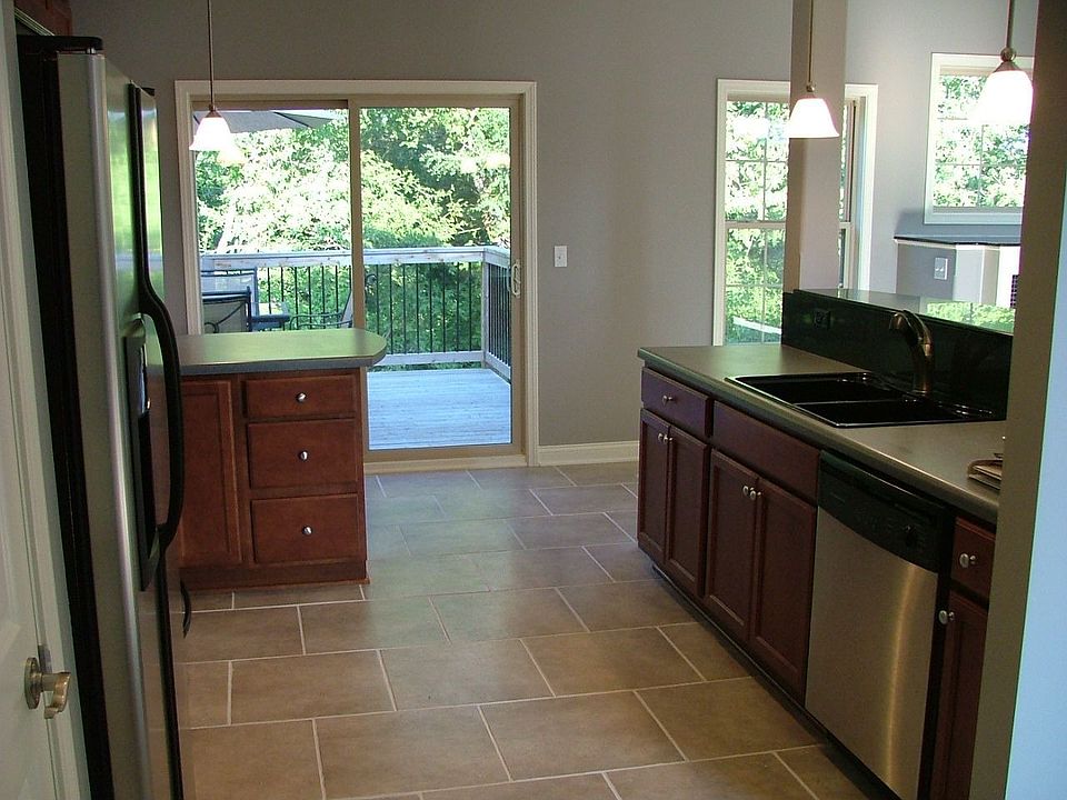 Lovely kitchen with stainless steel appliances and tile backsplash