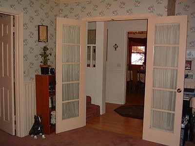 Lovely French doors lead from the Living Room into the Foyer. 