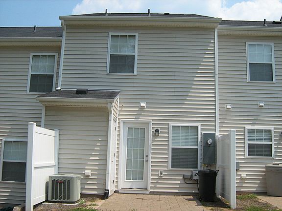 Back with privacy fence and patio