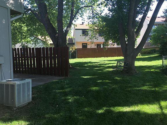 Nice patio in the back. Also, nice backyard with mature trees.