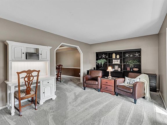 Formal living room would make great office space or play room for kids.