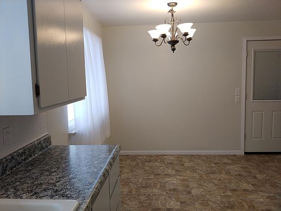 Dining room is ready for you to add your table, dinner, and memories.