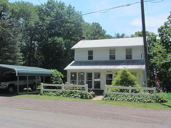 Front with 2 car carport