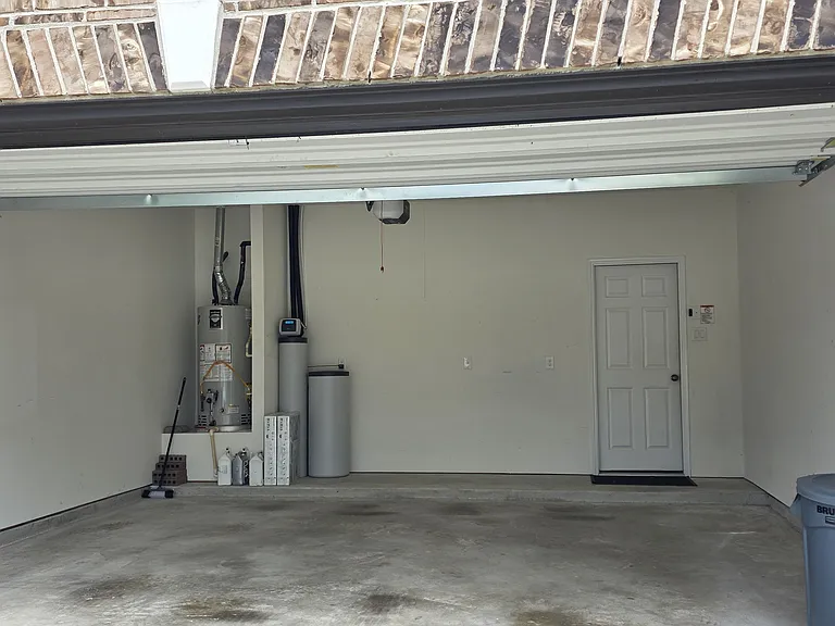 Spacious 2-car garage with Wi-Fi enabled garage door opener and whole home water softener
