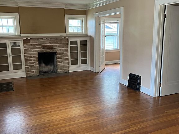 Bright and light living room with original hardwood floors.