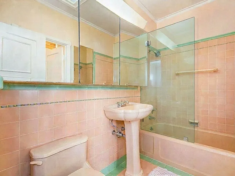Master Bathroom connecting to master suite on 2nd floor with original period details and tiling.