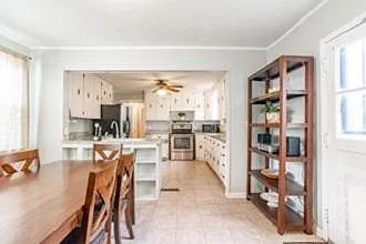 Photo 7. Open Dining Room and Kitchen
