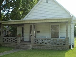 Front of the home with large porch.