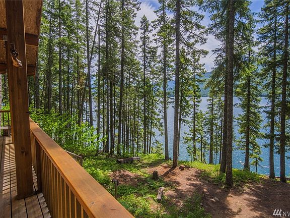 This cabin has plenty of open space for enjoying the lake views, while nestled in the trees.