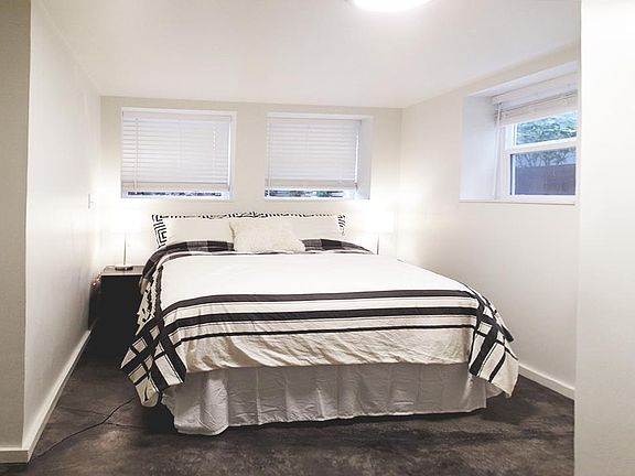 Master bedroom accommodates Queen size bed with plenty of windows.