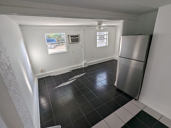 Open floor plan with window A/C and lots of sunlight in the afternoon.