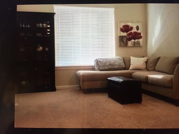 Living room has large window.