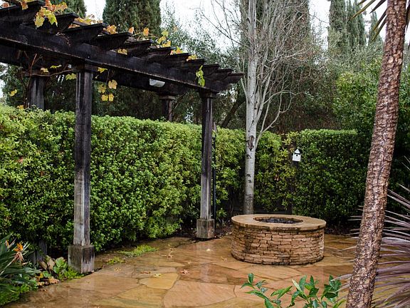 Backyard with natural gas fire pit. Easy to use and wonderful for cool Yountville summer nights.
