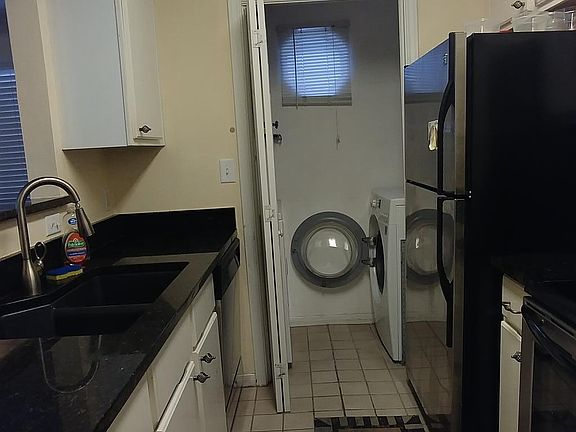 kitchen with the view of the laundry room