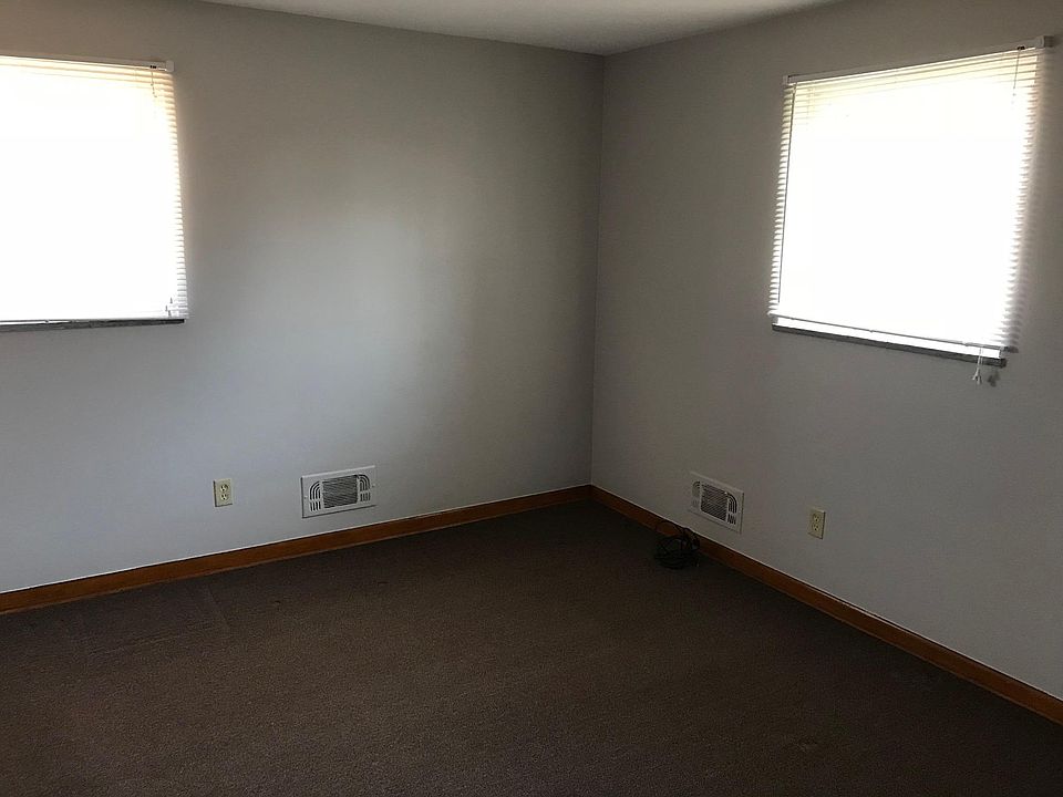 Bedroom with window treatments