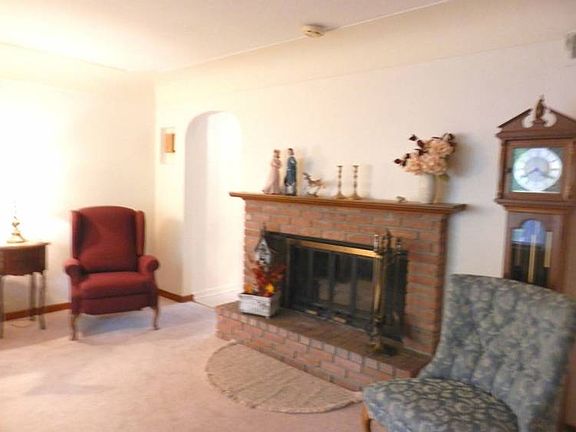 Living room includes fireplace