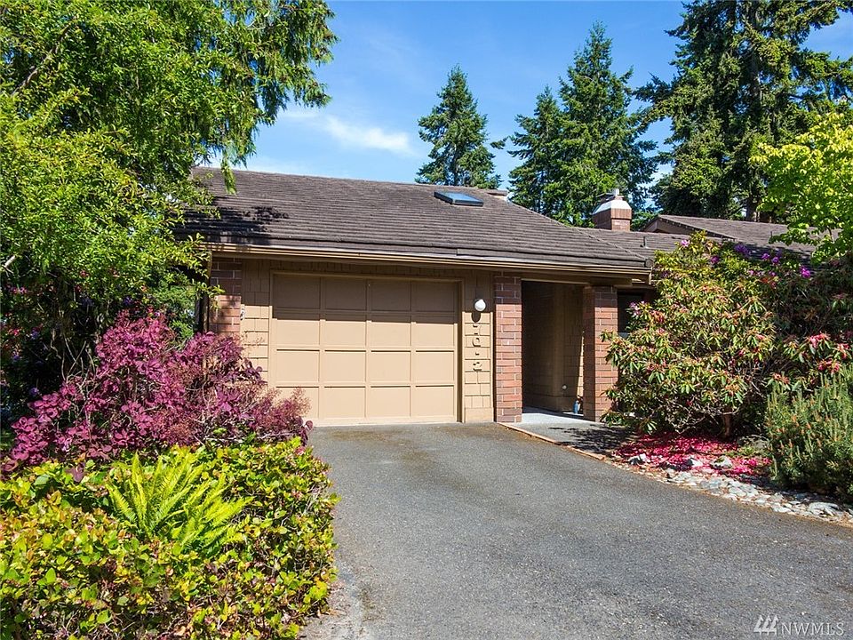 Condo is surrounded by mature landscape and is an end unit, adding privacy.