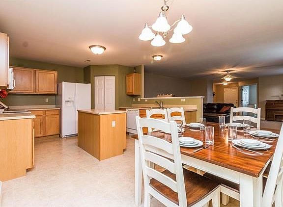 Eat in kitchen with an island and large pantry.