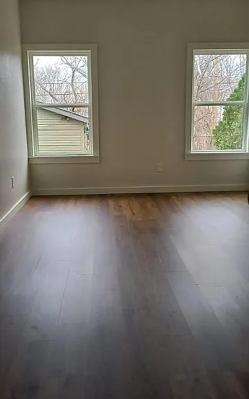 Portion of primary bedroom, faces backyard
