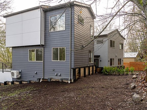 back and side yard - now with grown-up natural shrubs and plants
