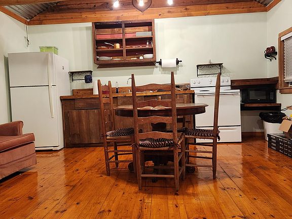Kitchen Area with included table, refrig, stove and microwave