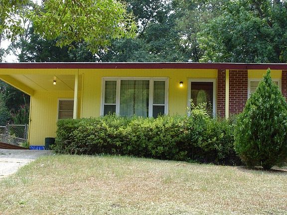 Front of House showing Carport