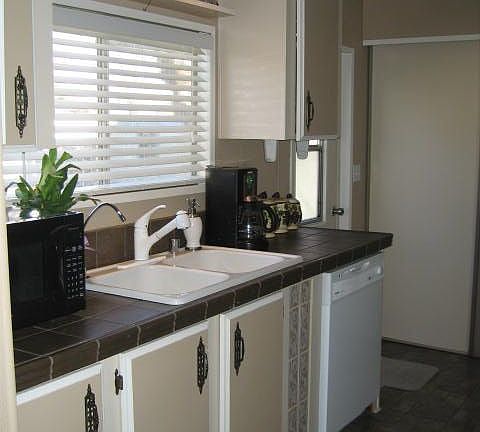 New flooring, sink, faucent, tile countertops and more