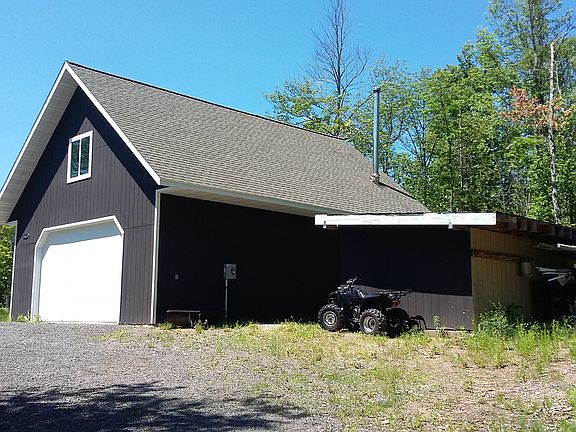 Northwest view garage & shed