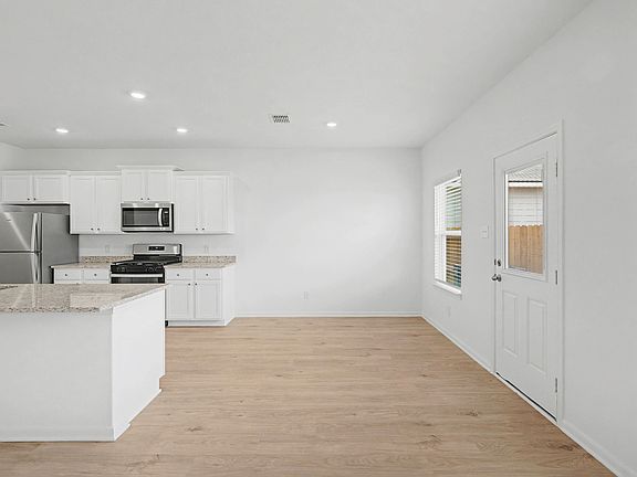 The dining area overlooks the back yard, providing lovely views as you eat.