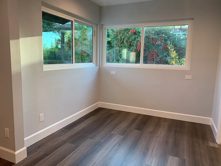 sitting / reading / office area off the primary bedroom with garden views