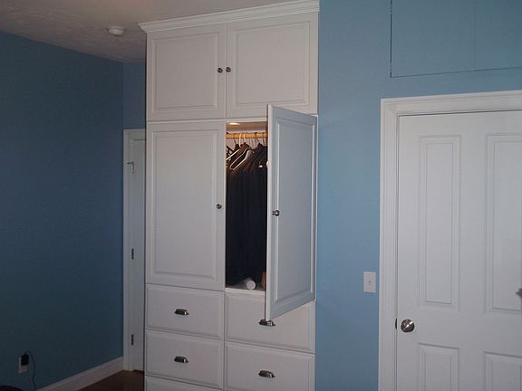 Bedroom with custom built-in armoire