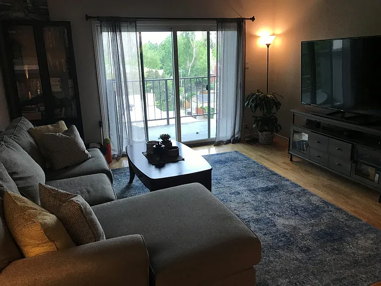 Living room with south facing balcony.