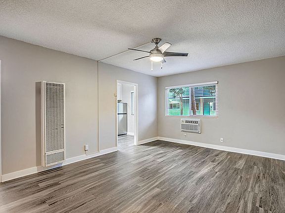 The Island Apartments unfurnished living room and window