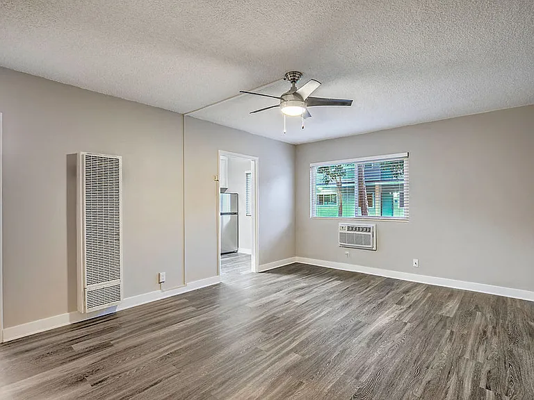 The Island Apartments unfurnished living room and window