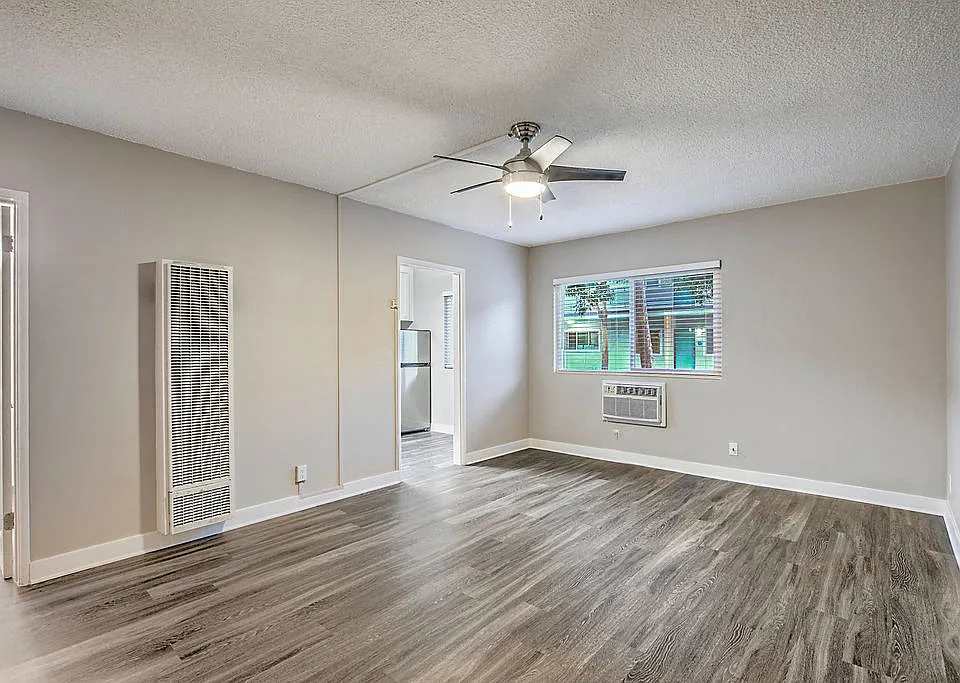 The Island Apartments unfurnished living room and window