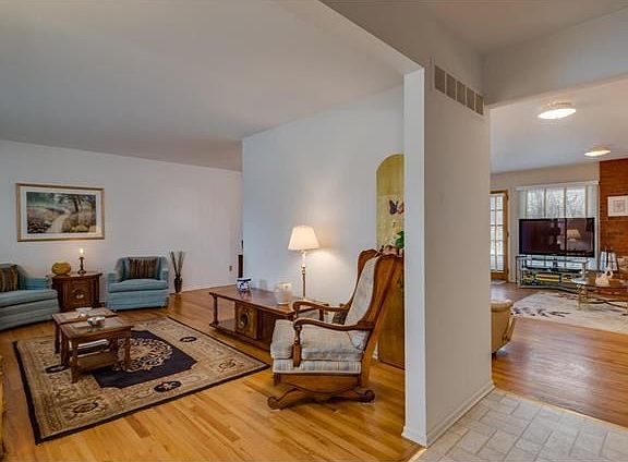 The large living room flows from the entry hall and nearby family room