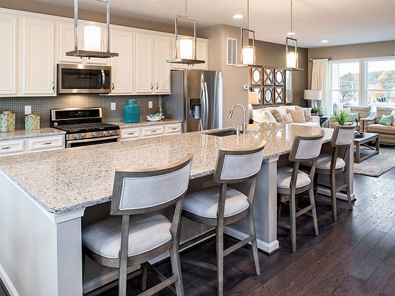 Model Representation - Kitchen with Oversized Island, Granite Countertops, Hardwood and Stainless St