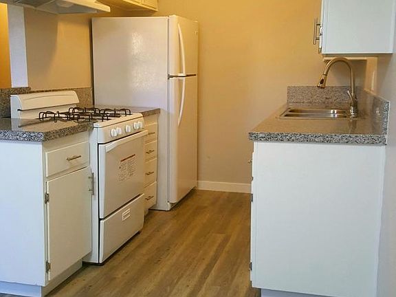 Full kitchen view with quartz counter tops