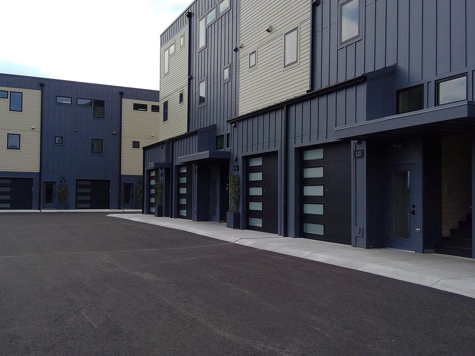 Heated garage with 13' ceilings 9' wide x 8' tall overhead door with smart opener technology , Outlet and breaker for electric charging port. Private walk up entrance next to garage. The stairwell is only to your unit and is not shared.