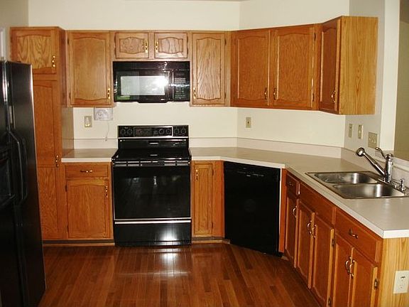 Eat-In kitchen features hwd flrs, lots of cabinets, 
