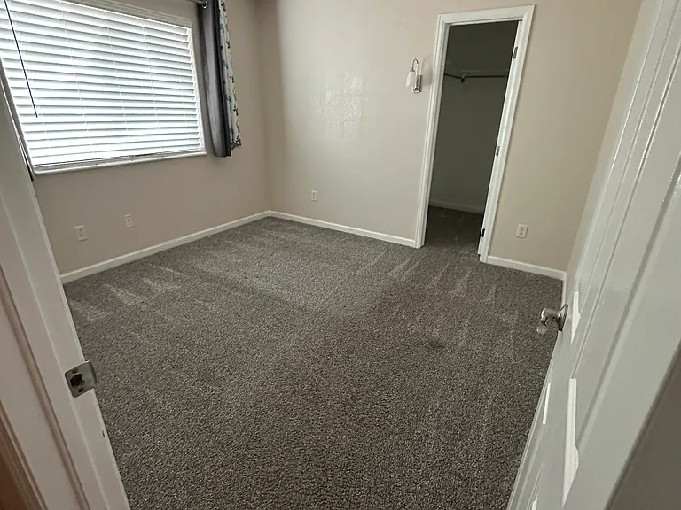 Secondary bedroom with walkin closet