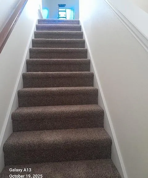 Stairway to bedrooms and game room