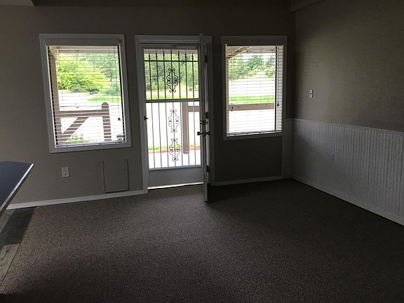Front Door with covered patio overlooking pond.