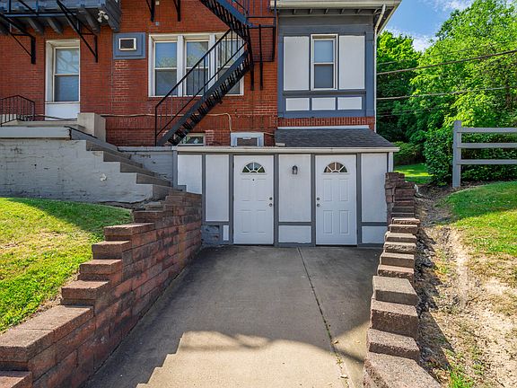 Entrance to the apartment is through the door on the left.
